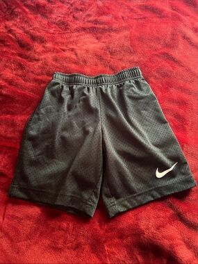 Nike Black Mesh Athletic Shorts with White Swoosh